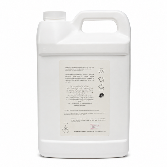 A large white plastic jug with a handle and a rectangular product label on the front, photographed against a plain white background.
