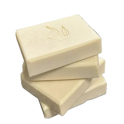 Four MamaSuds face wash bars stacked on each other on a white background.