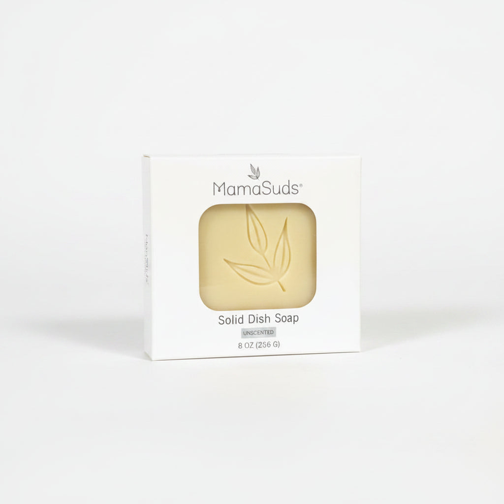 MamaSuds Solid Dish Soap bar in outer paper-based packaging in a white background. 