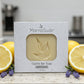 Limited Edition lavender lemon castile soap bar in a box on a kitchen counter top with lemons and lavender sprigs