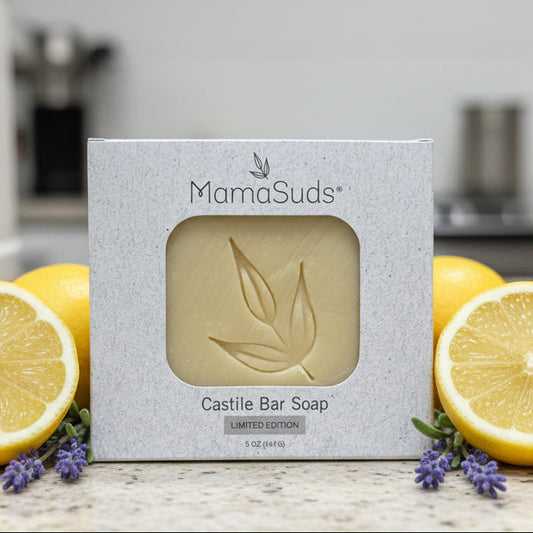 Limited Edition lavender lemon castile soap bar in a box on a kitchen counter top with lemons and lavender sprigs