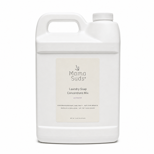 A large white plastic jug of Mama Suds Laundry Soap Concentrate Mix in lavender, featuring a clean white label with black text, set against a plain white background.